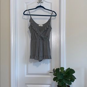 Grey ruffled romper.